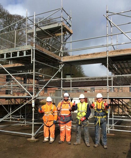 Encapsulated scaffold deck protecting live rail environment